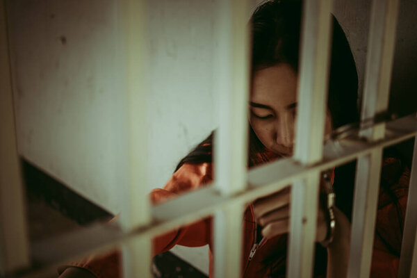 Hands of man desperate to catch the iron prison,prisoner concept,thailand people,Hope to be free.