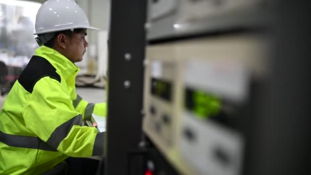 Electrical Engineer Man Checking Voltage Power Distribution Cabinet Control Room — Stock Video