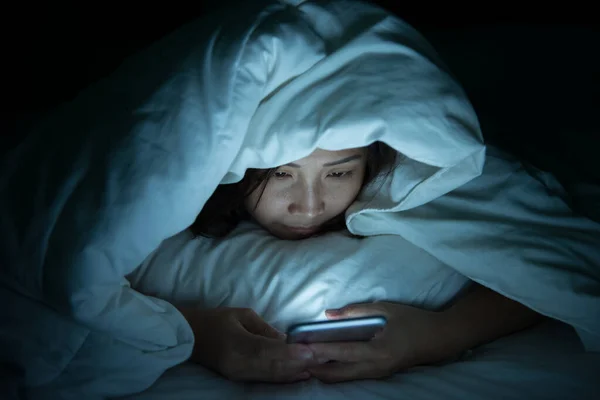 Asian woman play smartphone in the bed at night,Thailand people — sleepy,  pillow - Stock Photo | #316316904