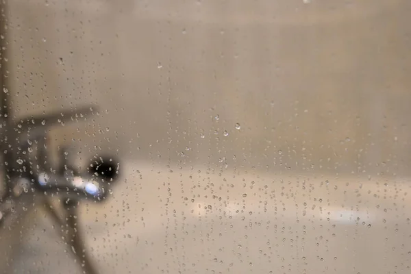 glass shower screen with water drops