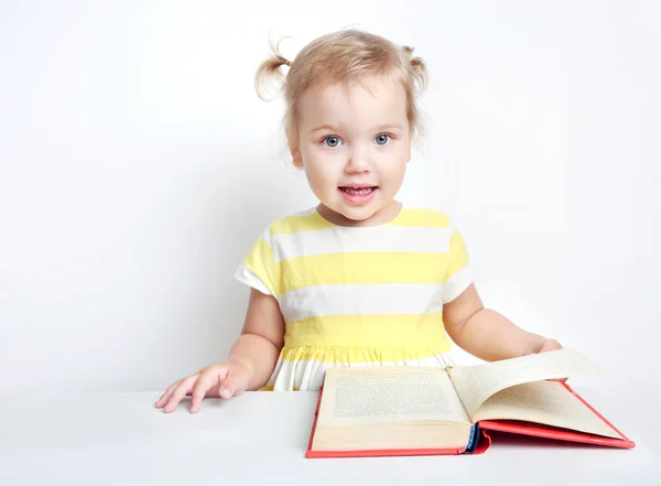 Child with book, kid reading, toddler girl study . — стоковое фото