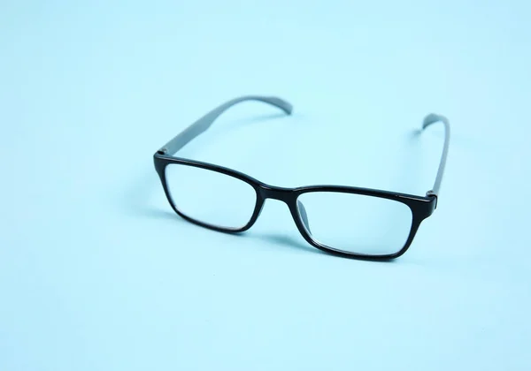 Óculos Óculos Pretos Sobre Fundo Azul Objeto Estúdio — Fotografia de Stock