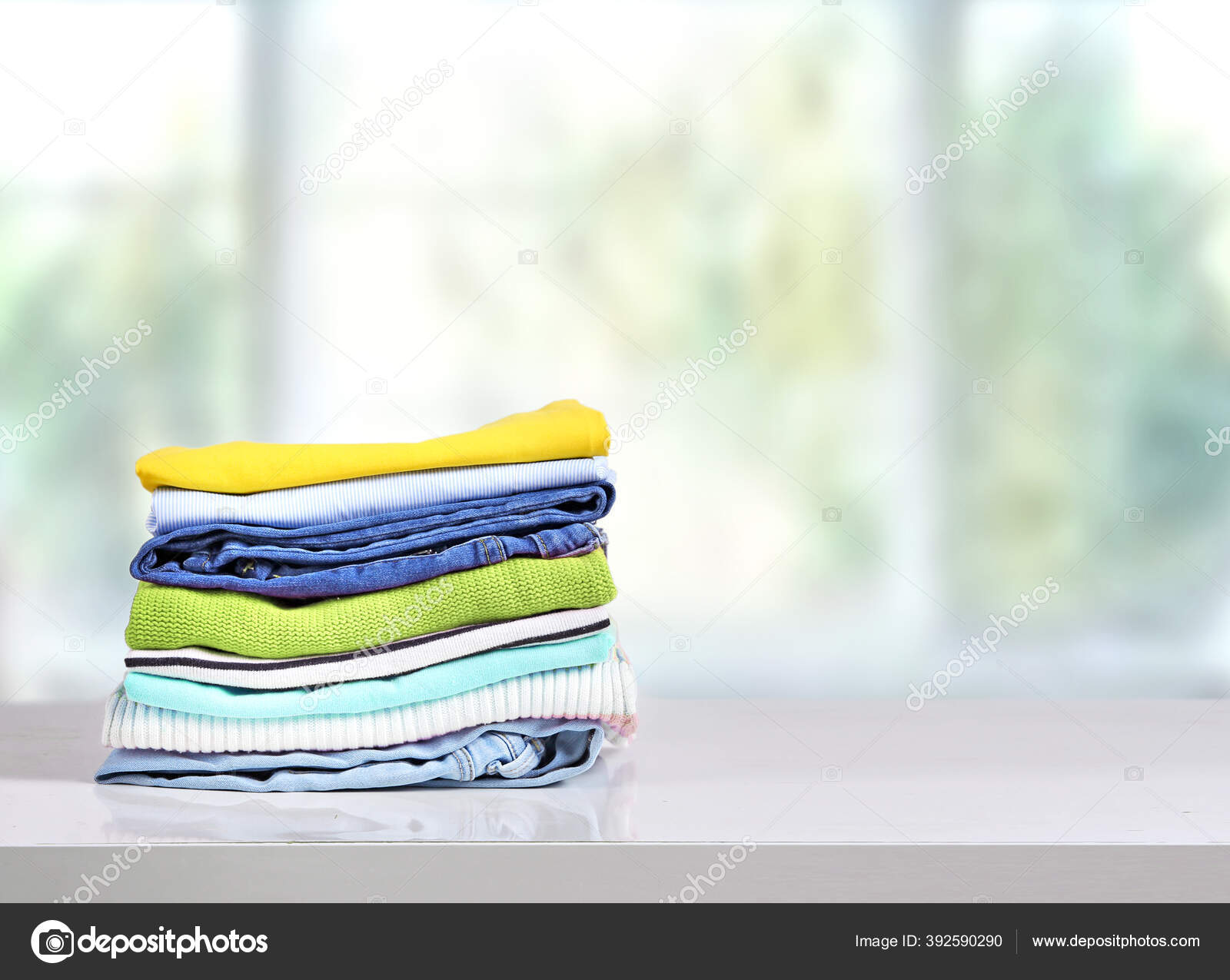 Cotton Stack Colorful Folded Clothes White Table Indoors Empty
