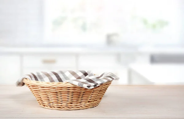 Straw empty basket on kitchen table.Food advertisement display.Container to promote product.
