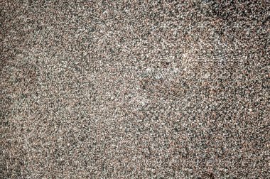 Granüler çatı kaplaması, küçük kırmızı-kahverengi taşlar, taş kırıntıları.