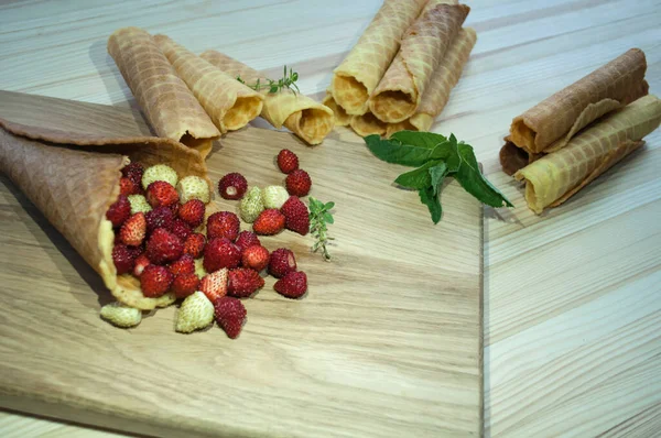 Golden Waffle Cone Filled Strawberries Many Waffle Tubes Wooden Background — Stock Photo, Image