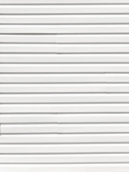 horizontal stripes on light white vinyl siding outside