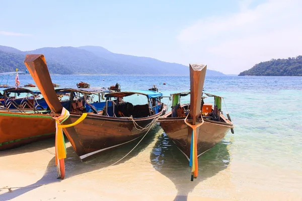 Thai wooden boat on sea beach at Lipe island, Satun province, Thailand