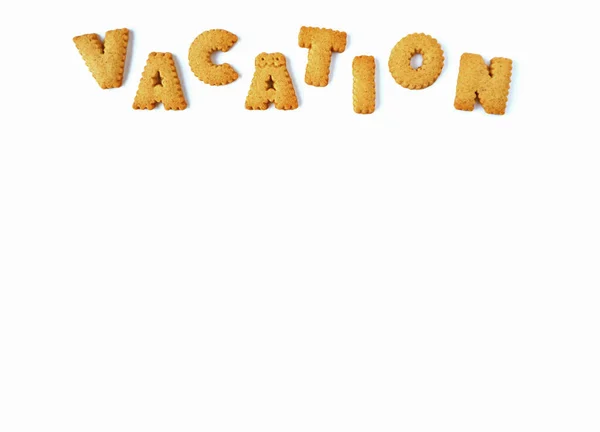 Top View Word Vacation Spelling Alphabet Shaped Biscuits White Background — Stock Photo, Image