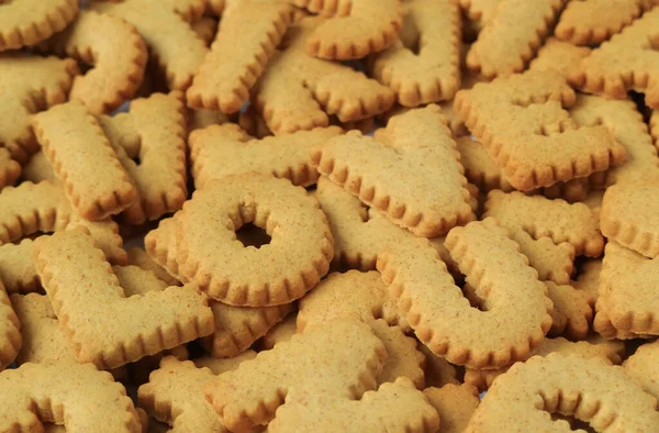 Close Word Love Spelled Alphabet Shaped Biscuits Pile Same Biscuits — Stock Photo, Image