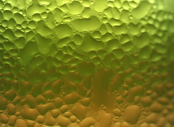 Macro Shot Água Cai Textura Vidro Verde Laranja Dois Tons — Fotografia de Stock