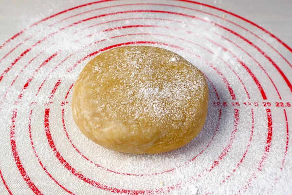 Pie dough isolated on a baking mat for the concept of baking at home