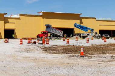 Kokomo - Circa May 2018: New strip mall construction. Even with competition from the internet, brick and mortar stores are still in demand IV clipart
