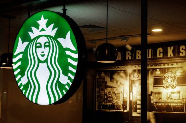 Indianapolis - Circa July 2018: Starbucks Retail Coffee Store. Starbucks aims to Eliminate Plastic Straws Globally by 2020 III clipart