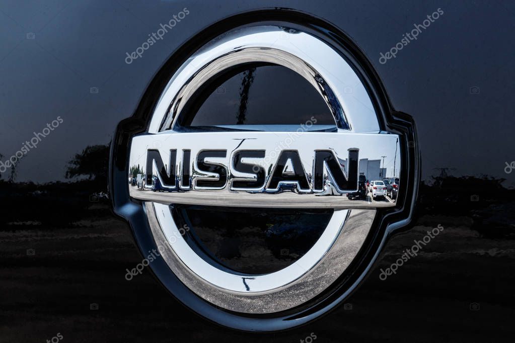 Fishers - Circa August 2018: Logo and Signage of a Nissan Car and SUV Dealership. Nissan is part of the Renault Nissan Alliance VI