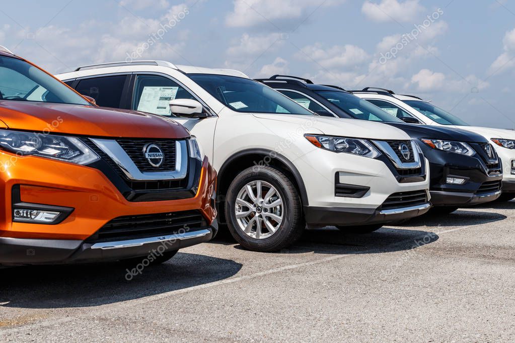 Fishers - Circa August 2018: Logo and Signage of a Nissan Car and SUV Dealership. Nissan is part of the Renault Nissan Alliance VI