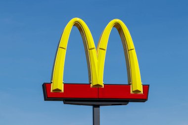 Muncie - Circa March 2019: McDonald's Restaurant Location. McDonald's will no longer lobby against minimum wage hikes IV clipart