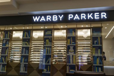 Indianapolis - Circa September 2019: Warby Parker retail glasses store. For every pair of Warby Parker glasses purchased, a pair of glasses is distributed to someone in need clipart