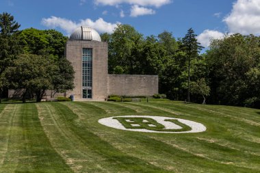 Indianapolis - Circa May 2020: Holcomb Observatory and Planetarium on the campus of Butler University. The telescope is the largest in the state of Indiana. clipart