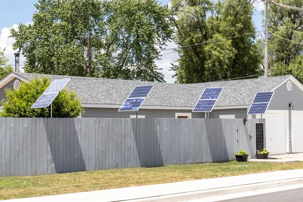 Solar Thermal Flat Panels in a residential neighborhood. Residents are installing renewable energy sources to reduce their carbon footprint.