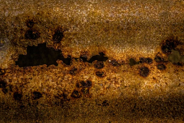 Rusty metal sheet with dents and holes. — Stock Photo, Image