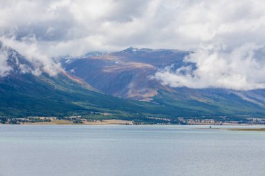 Wild mountain lake in the Altai mountains, summer landscape, Mongolia landscape. Altai Tavan Bogd National Park in Bayar-Ulgii. Scenic valley on the background of the snowcapped mountains clipart