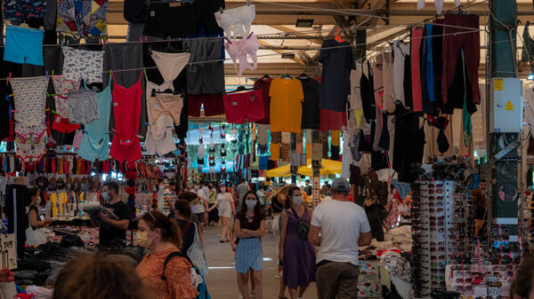 Karsiyaka, izmir / turkey - 09.09.2020: in wednesday grand bostannli bazaar, people walking on corridors and between stands and shopping.