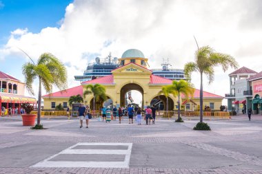 BASSETERRE, ST. KITS AND NEVIS 14 DECEMBER, 2016: Cruise passengers return to cruise ships clipart