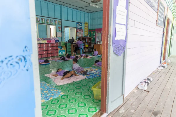 THAILAND, PHUKET - JANUARY 10, 2018 - Children sleeping on floor in school in Ko Panyi the Gipsy village on water — Stock Photo, Image