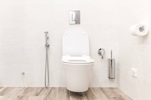 Toilet bowl in modern white style bathroom