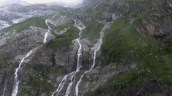 Tall waterfalls in Arhiz Russia. Epic cascade Waterfalls background. ecology Concept.