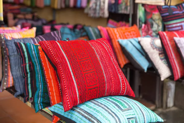 Colorful pillows at sales counter at asian market