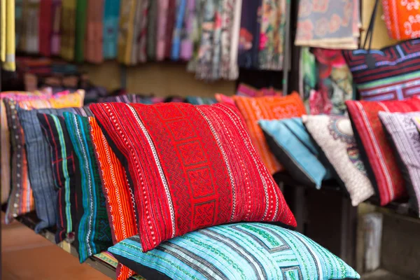 Colorful pillows at sales counter at asian market