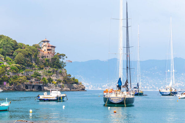 PORTOFINO , ITALY - MAY 08, 2018: The beautiful Portofino with colorful houses and villas in little bay harbor. Liguria, Italy