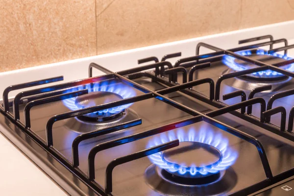 Gas burner on black modern kitchen stove — Stock Photo, Image