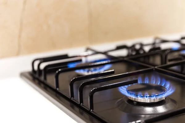 Gas burner on black modern kitchen stove — Stock Photo, Image