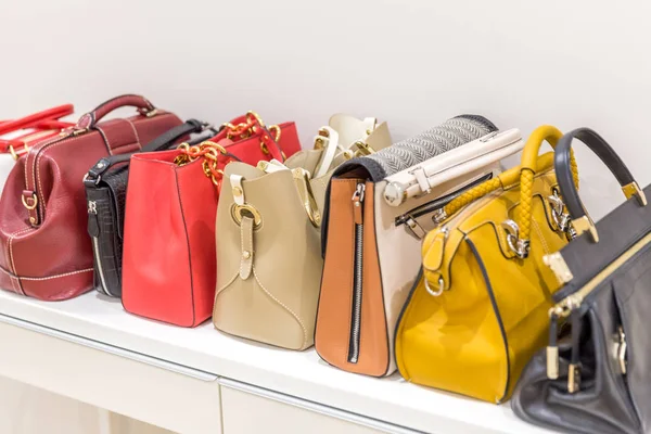 Collection of handbags standing in a row — Stock Photo, Image