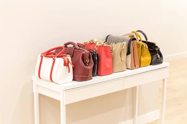 Collection of handbags standing in a row — Stock Photo, Image