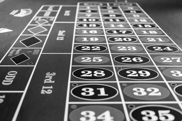 Roulette table in luxury casino. Black and white photo — Stock fotografie