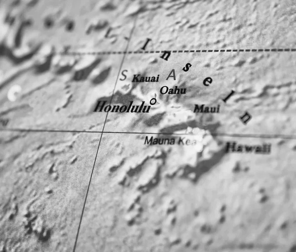 Hawaii map part of a world globe, black and white photo