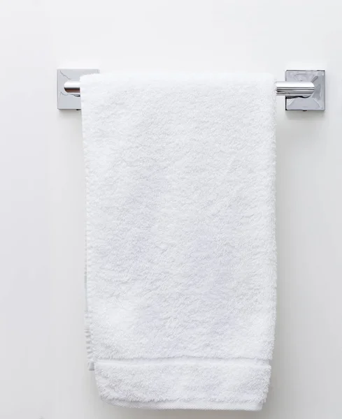 Modern bathroom towel dryer on white wall background