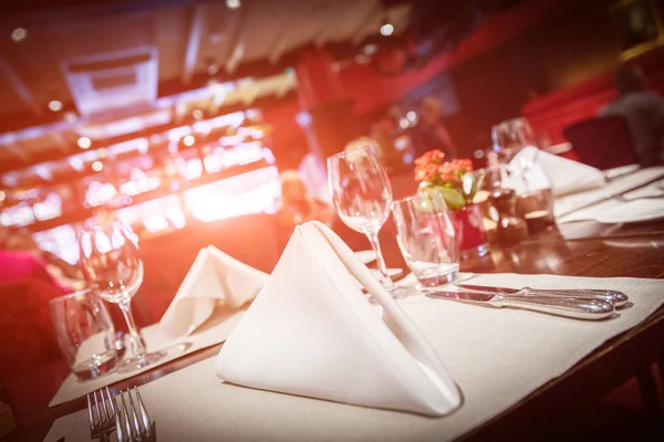Fine table setting with red light flare — Stock Photo, Image