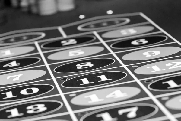 Roulette table in luxury casino. Black and white photo — Stock fotografie