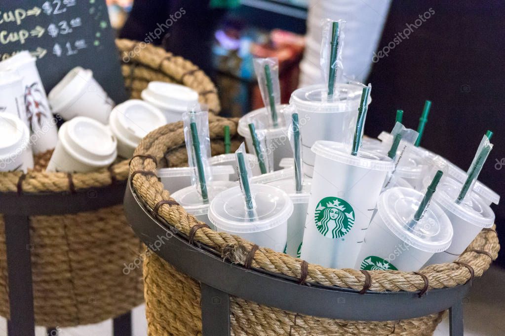 NEW YORK, USA - 17 MAY, 2019: Starbucks reusable coffee cups on sale in cafe in New York. People who use their own cup get discount for coffee