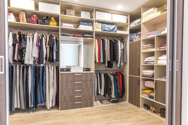 Big wardrobe with different clothes for dressing room — Stock Photo, Image