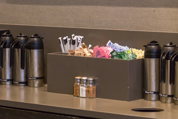 NEW YORK, USA - MAY 15, 2019: Counter in Starbucks cafe with Straws and sugar to pick up to go — Stock Photo, Image