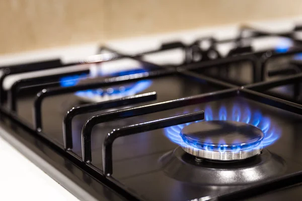 Blue flames on gas stove burner at home — Stock Photo, Image