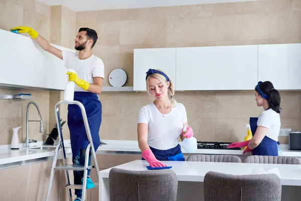 Cleaning service team at work in kitchen in private home — Stock Photo, Image