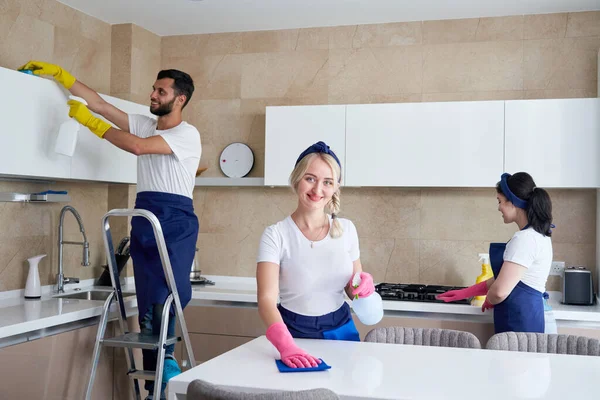 Cleaning service team at work in kitchen in private home — Stock Photo, Image