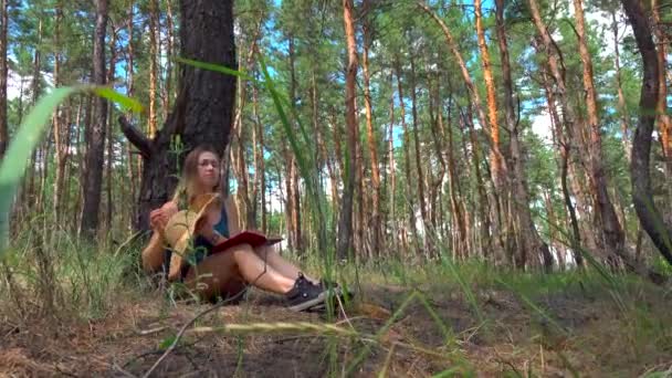 Young Woman Reading Book Outdoor Forest — Stock Video